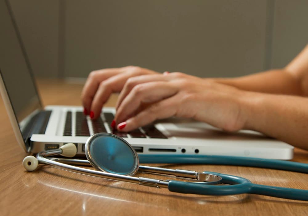 Empathetic patient support team coordinating healthcare enquiries, appointments, and care logistics